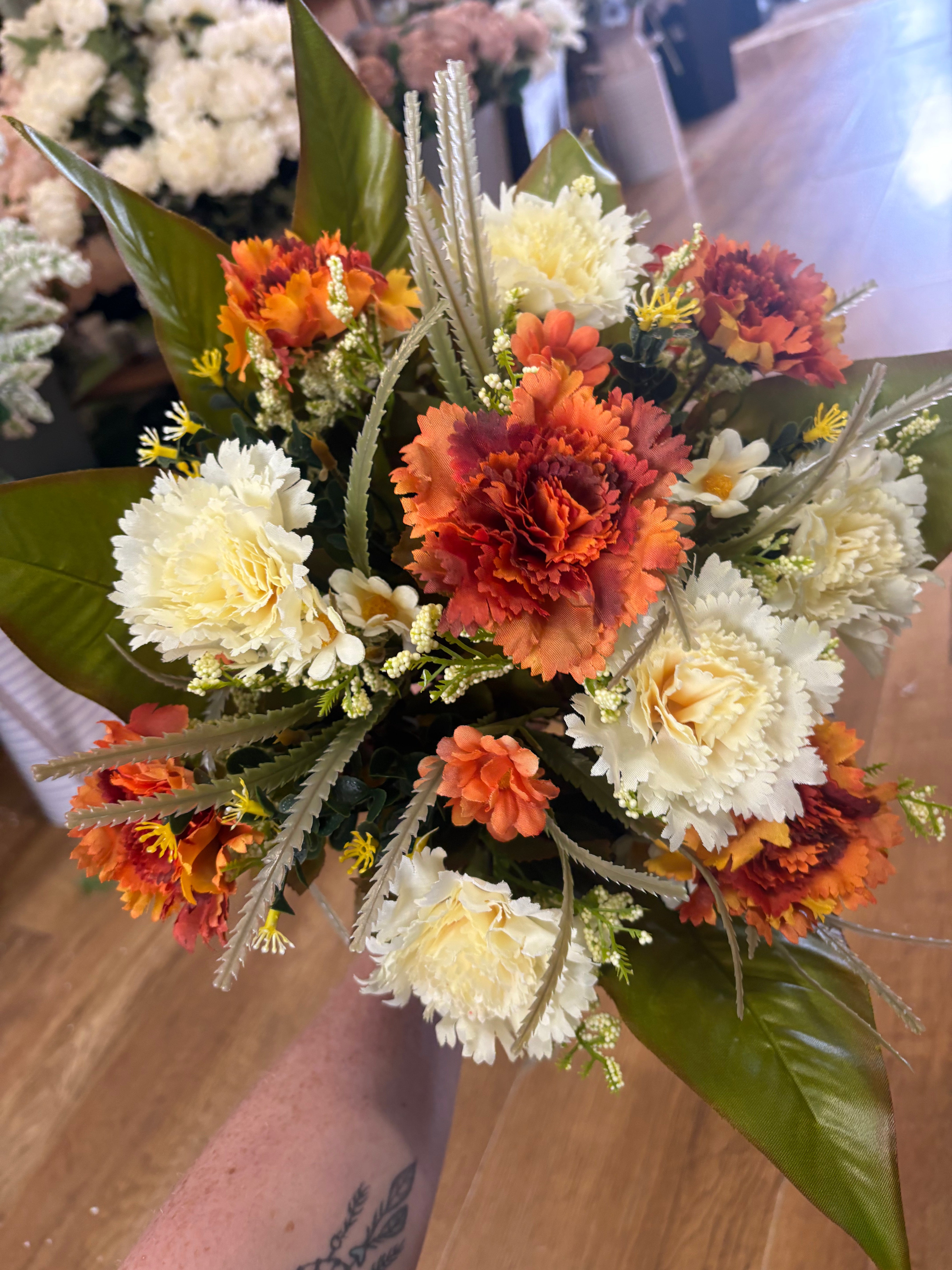 Large burnt orange and cream carnation and mixed foliage Bouquet