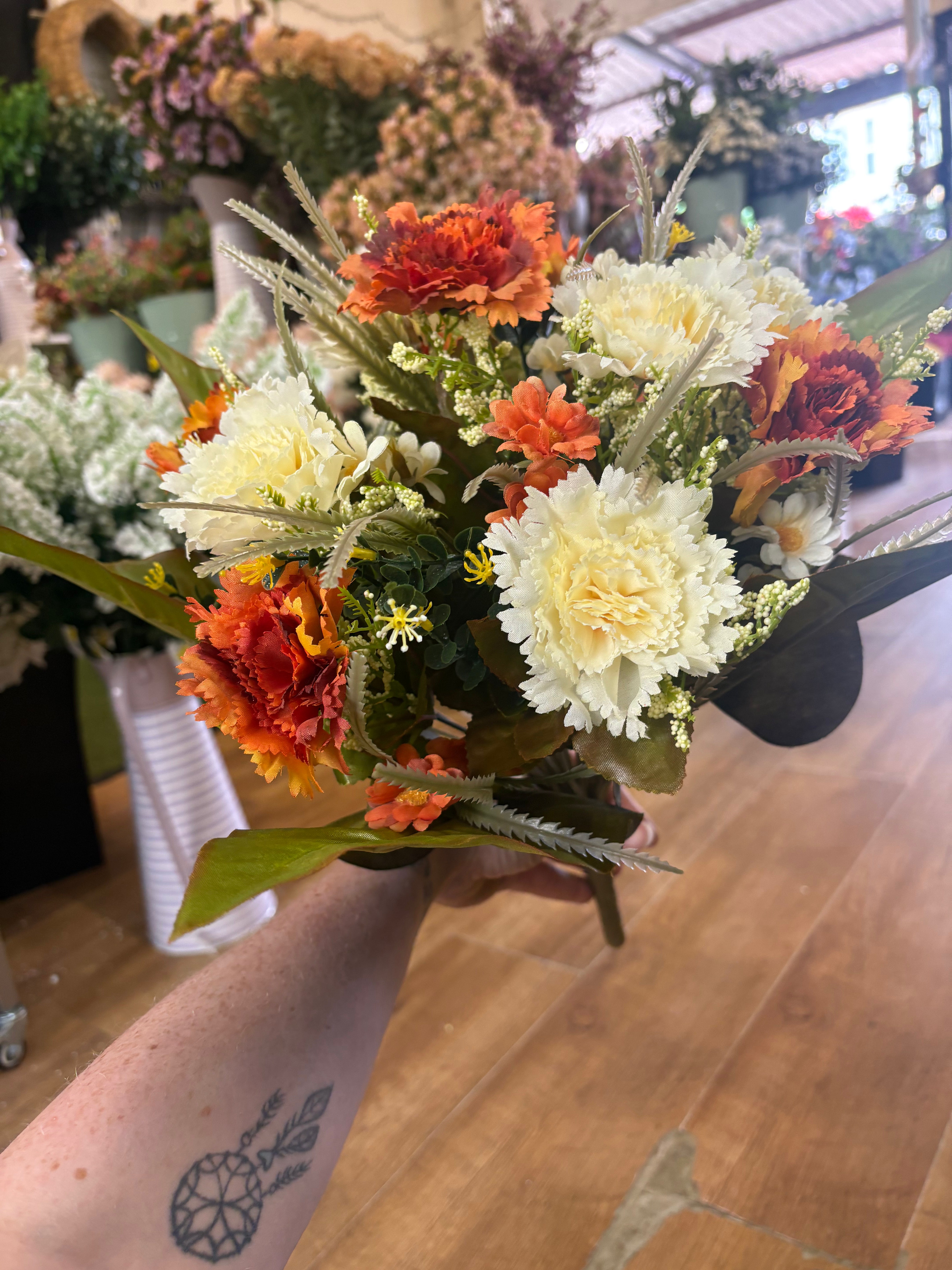 Large burnt orange and cream carnation and mixed foliage Bouquet
