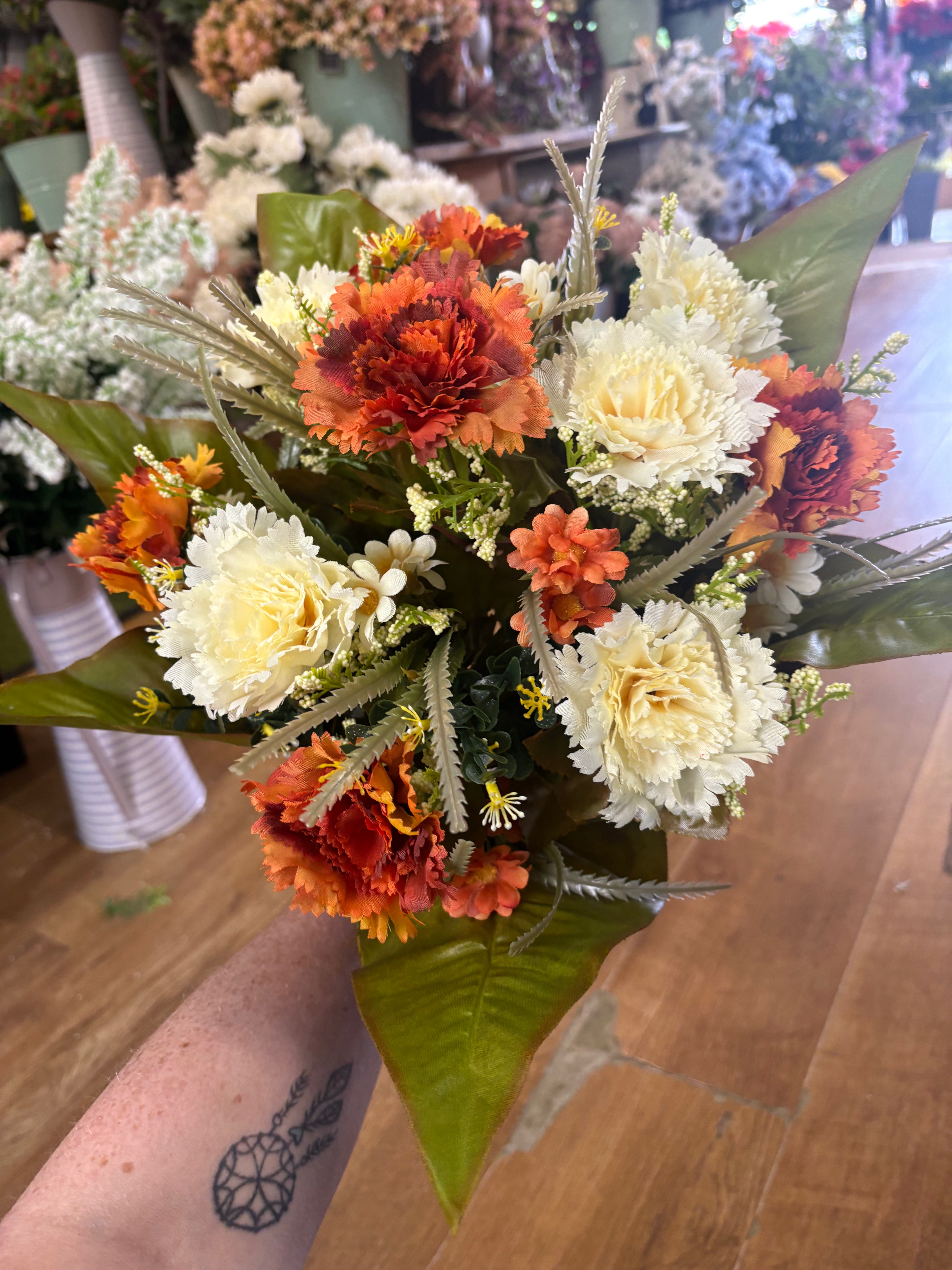 Large burnt orange and cream carnation and mixed foliage Bouquet