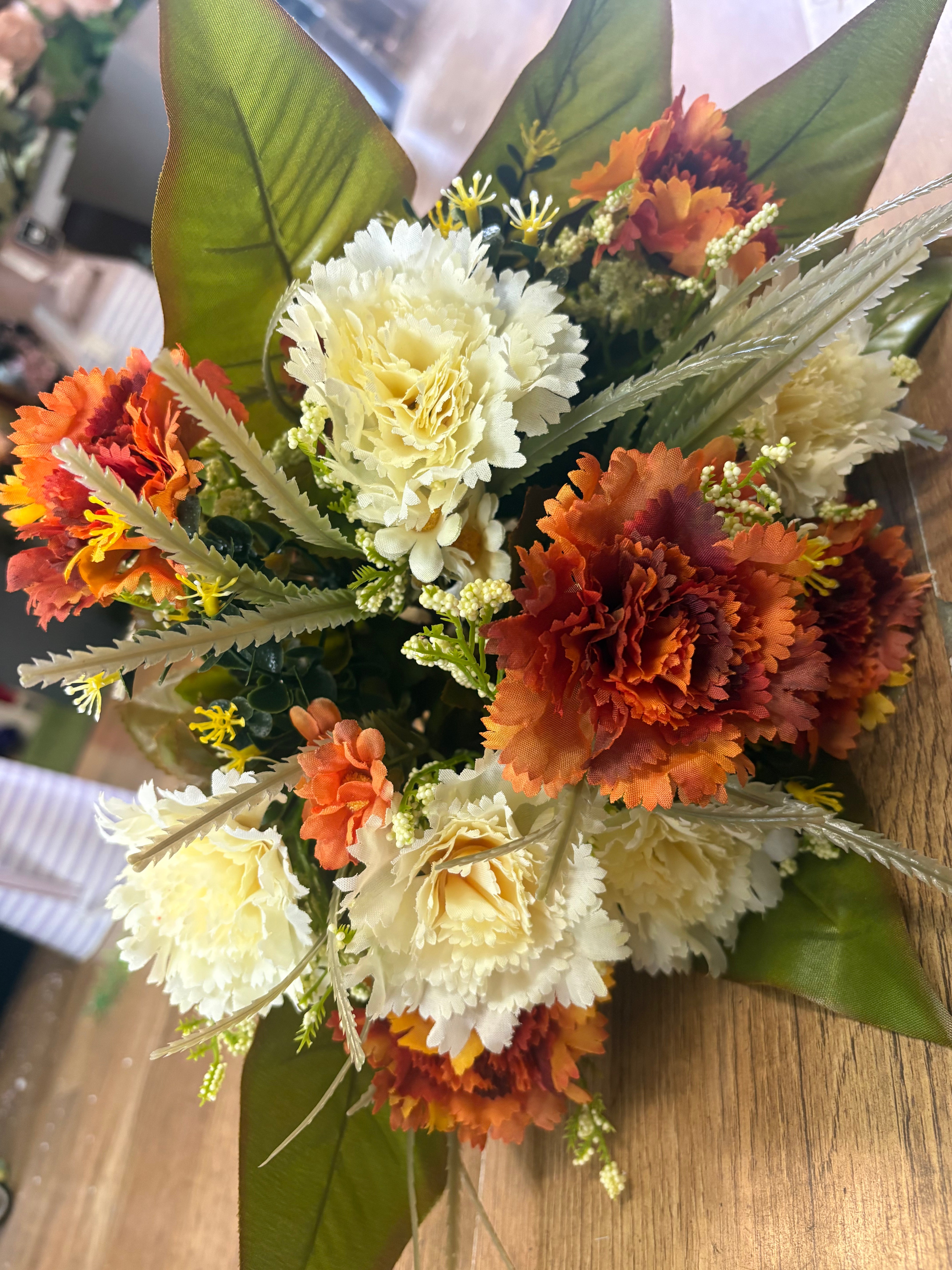 Large burnt orange and cream carnation and mixed foliage Bouquet