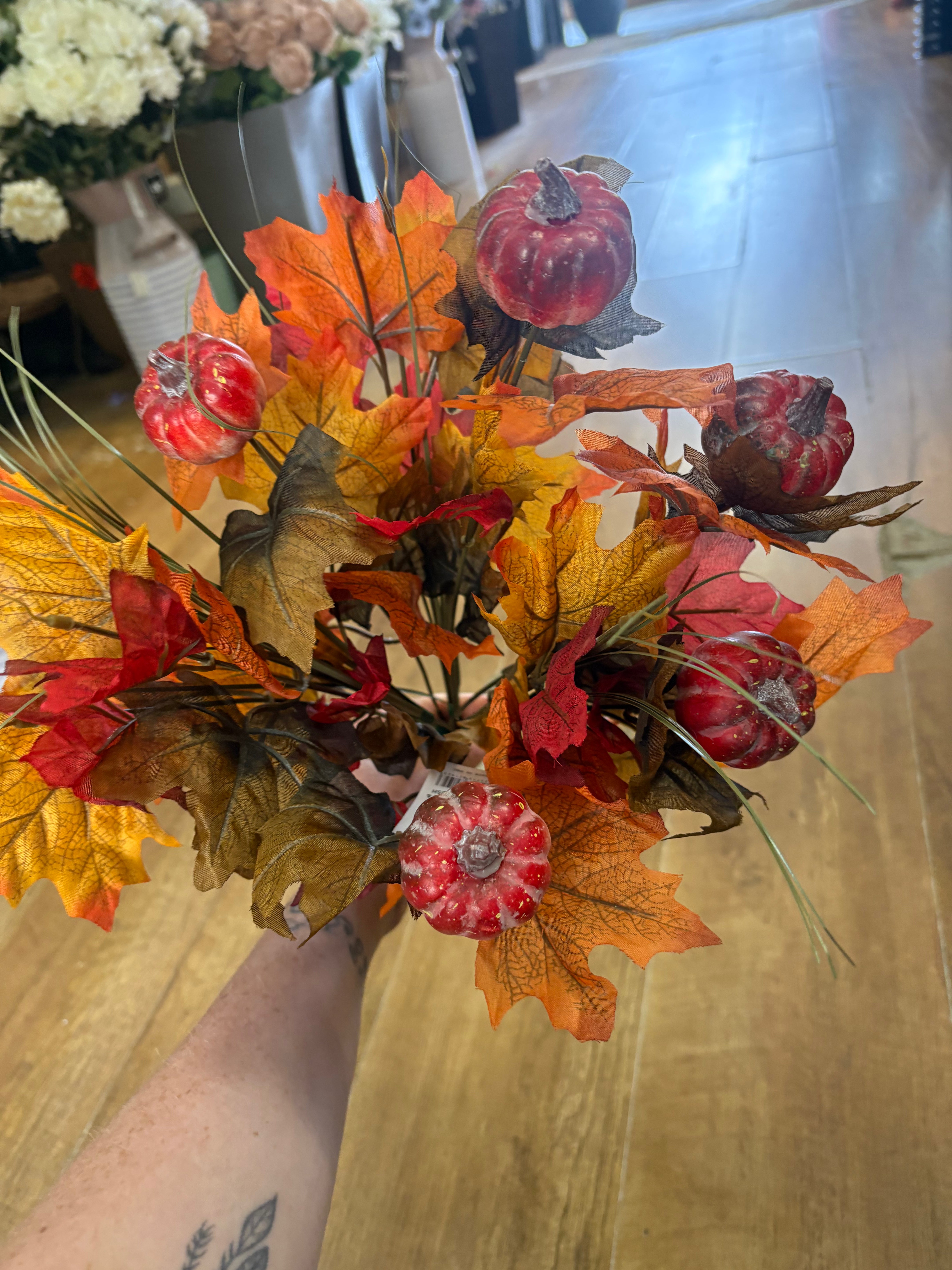 Large autumn leaves and orange pumpkins bunch