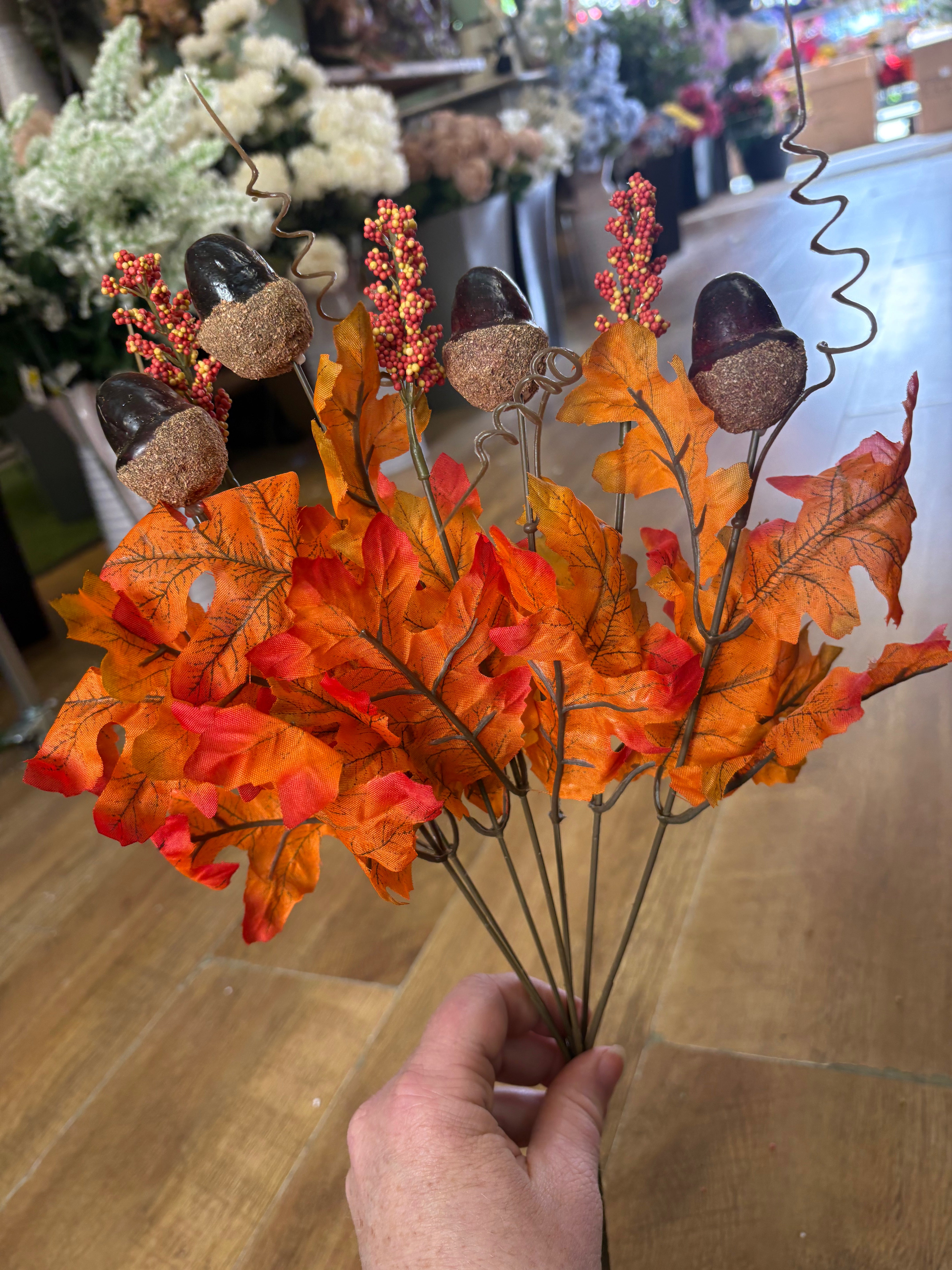 Autumnal orange acorn and foliage bunch