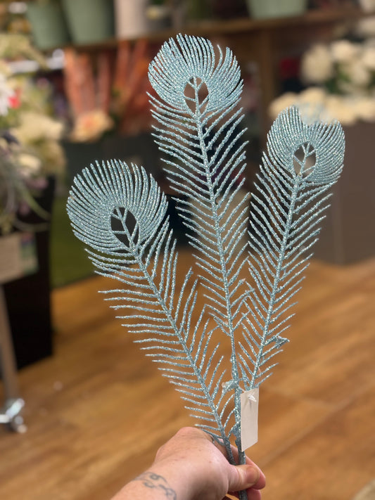 Long stem pale blue glittered peacock feathers