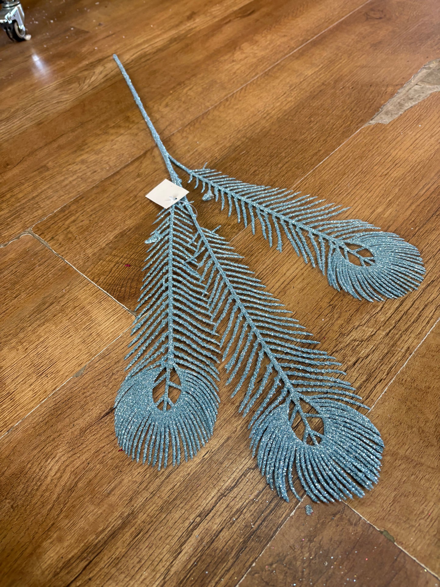 Long stem pale blue glittered peacock feathers