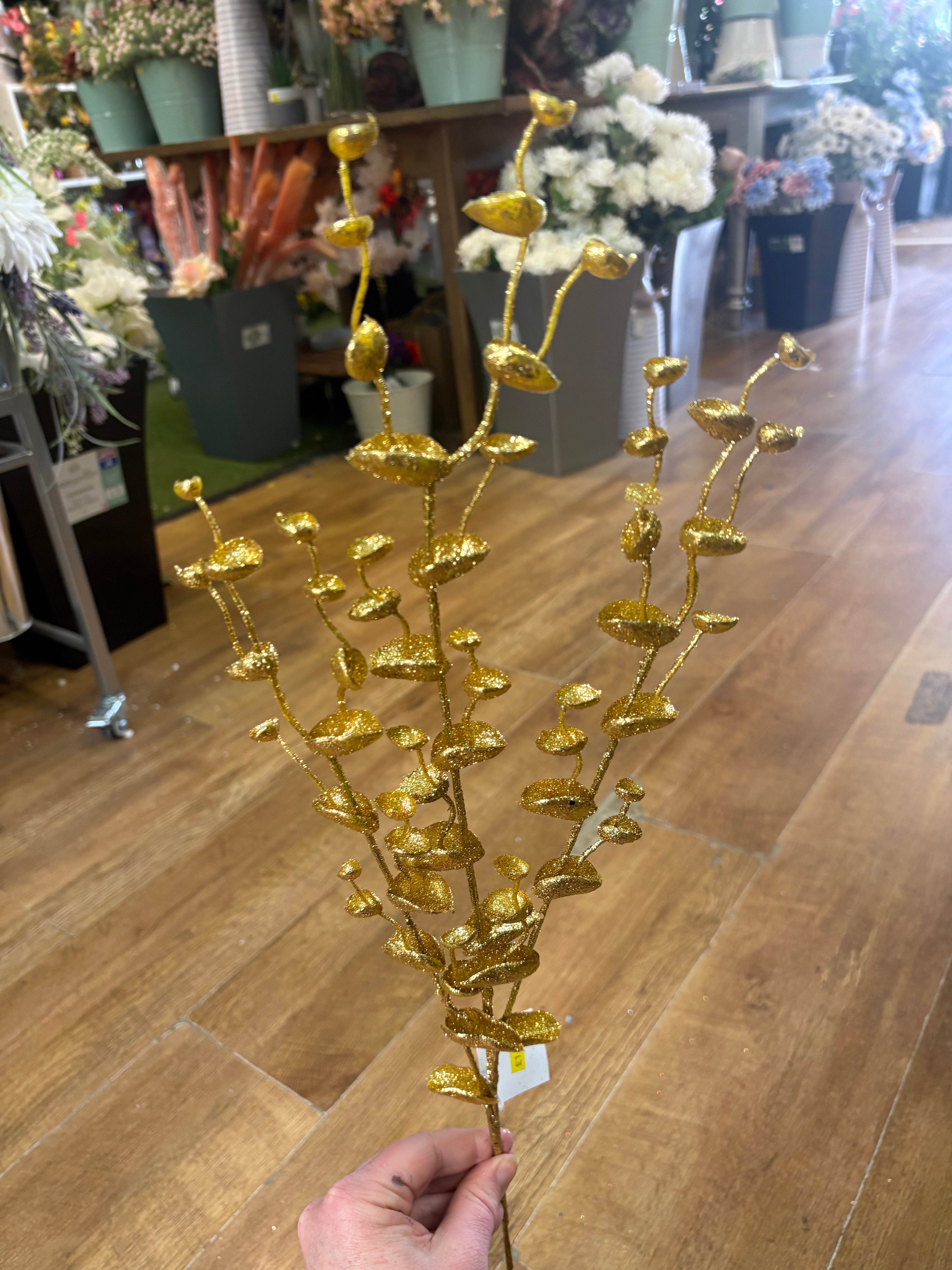 Long stem gold glittered eucalyptus filler