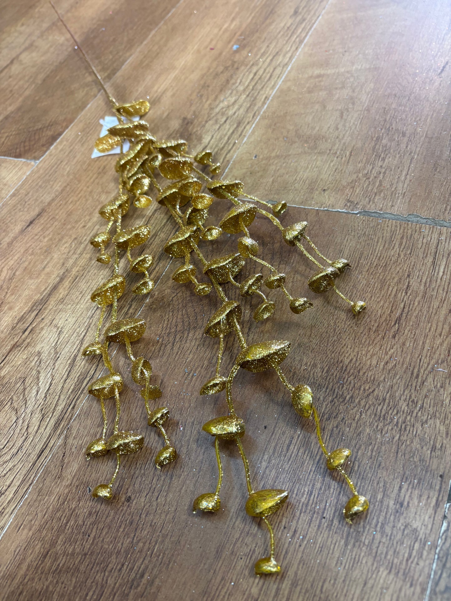 Long stem gold glittered eucalyptus filler