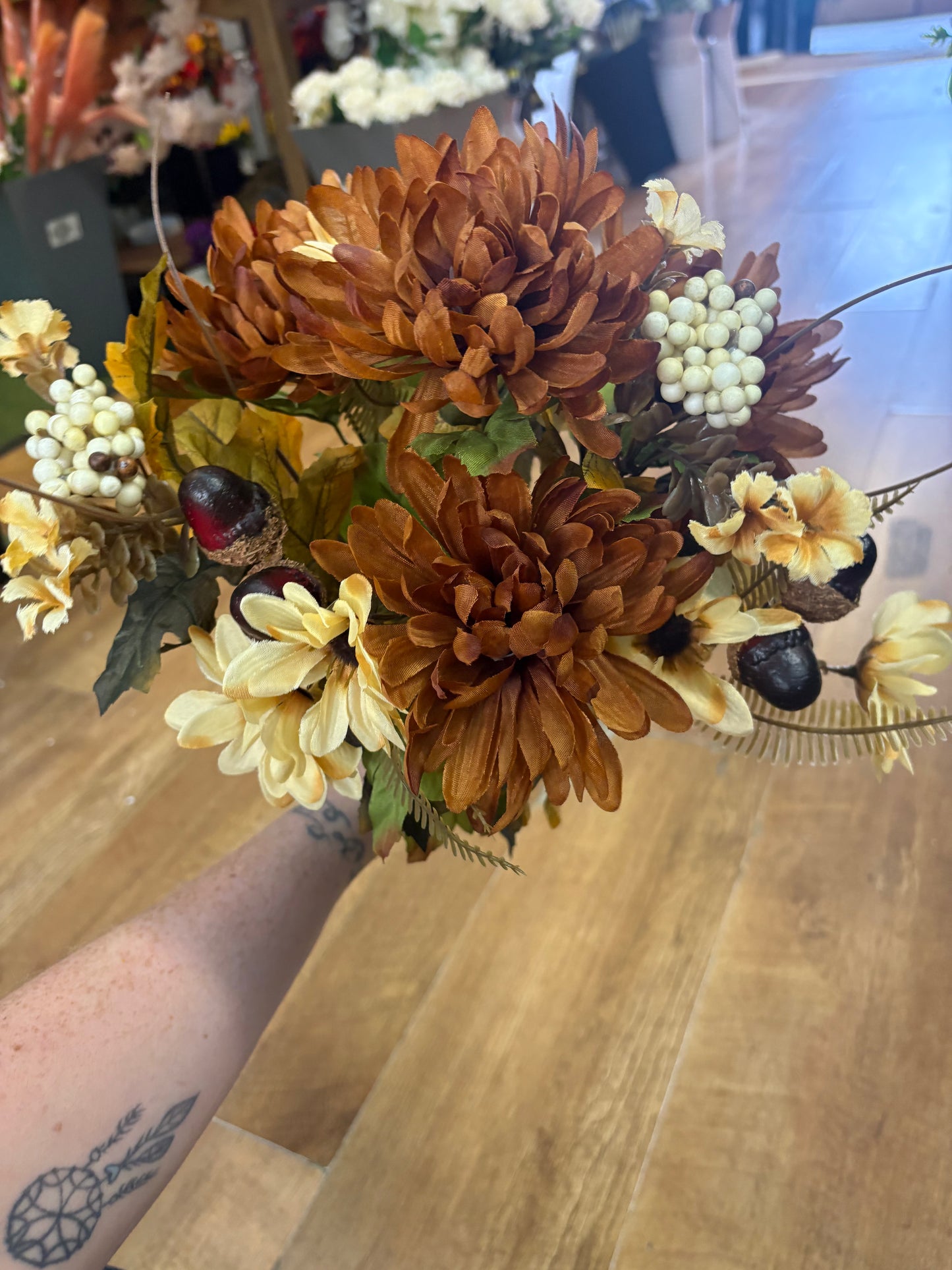 Brown and cream chrysanthemum, daisy and acorn bouquet