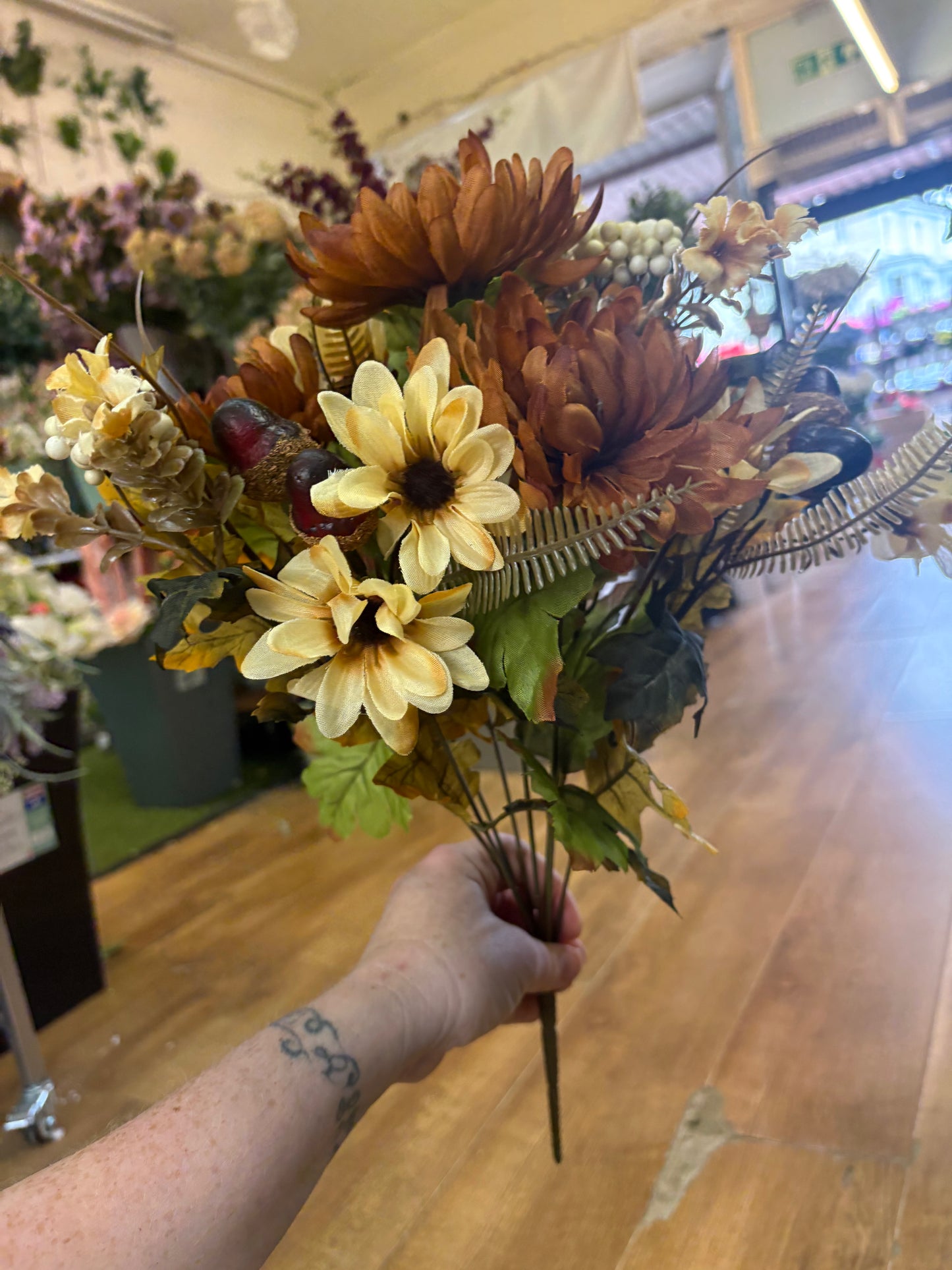 Brown and cream chrysanthemum, daisy and acorn bouquet