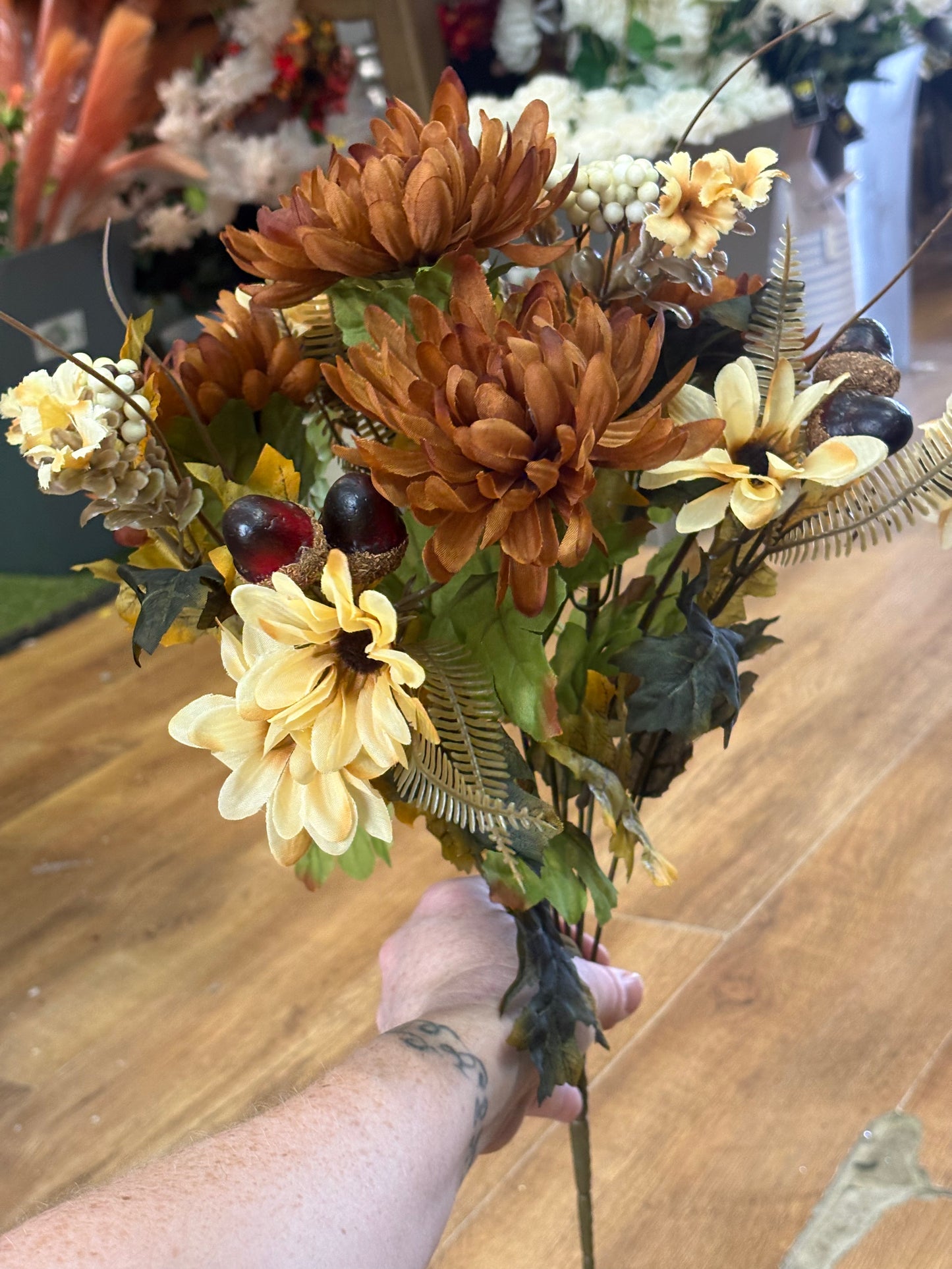 Brown and cream chrysanthemum, daisy and acorn bouquet