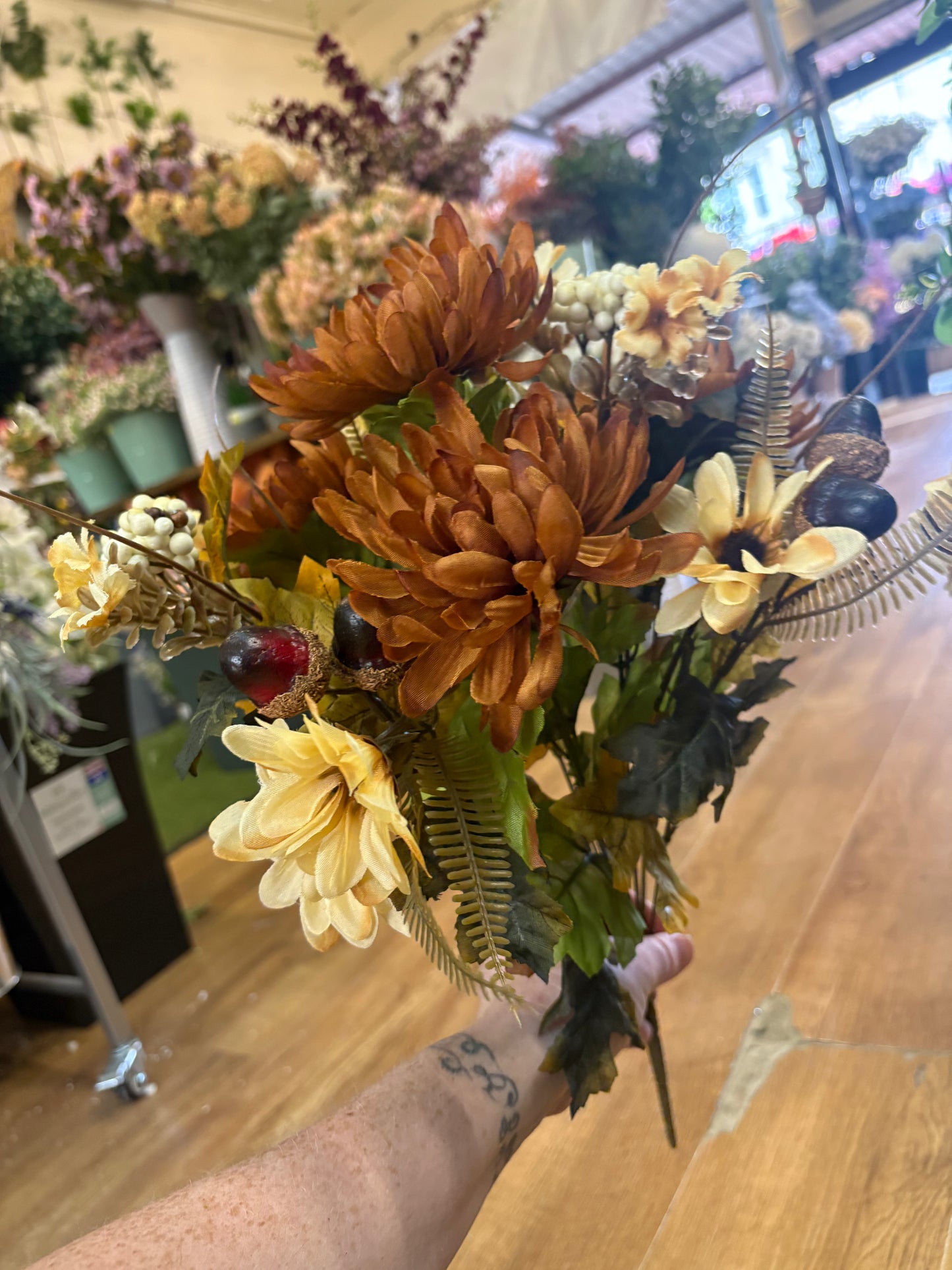 Brown and cream chrysanthemum, daisy and acorn bouquet