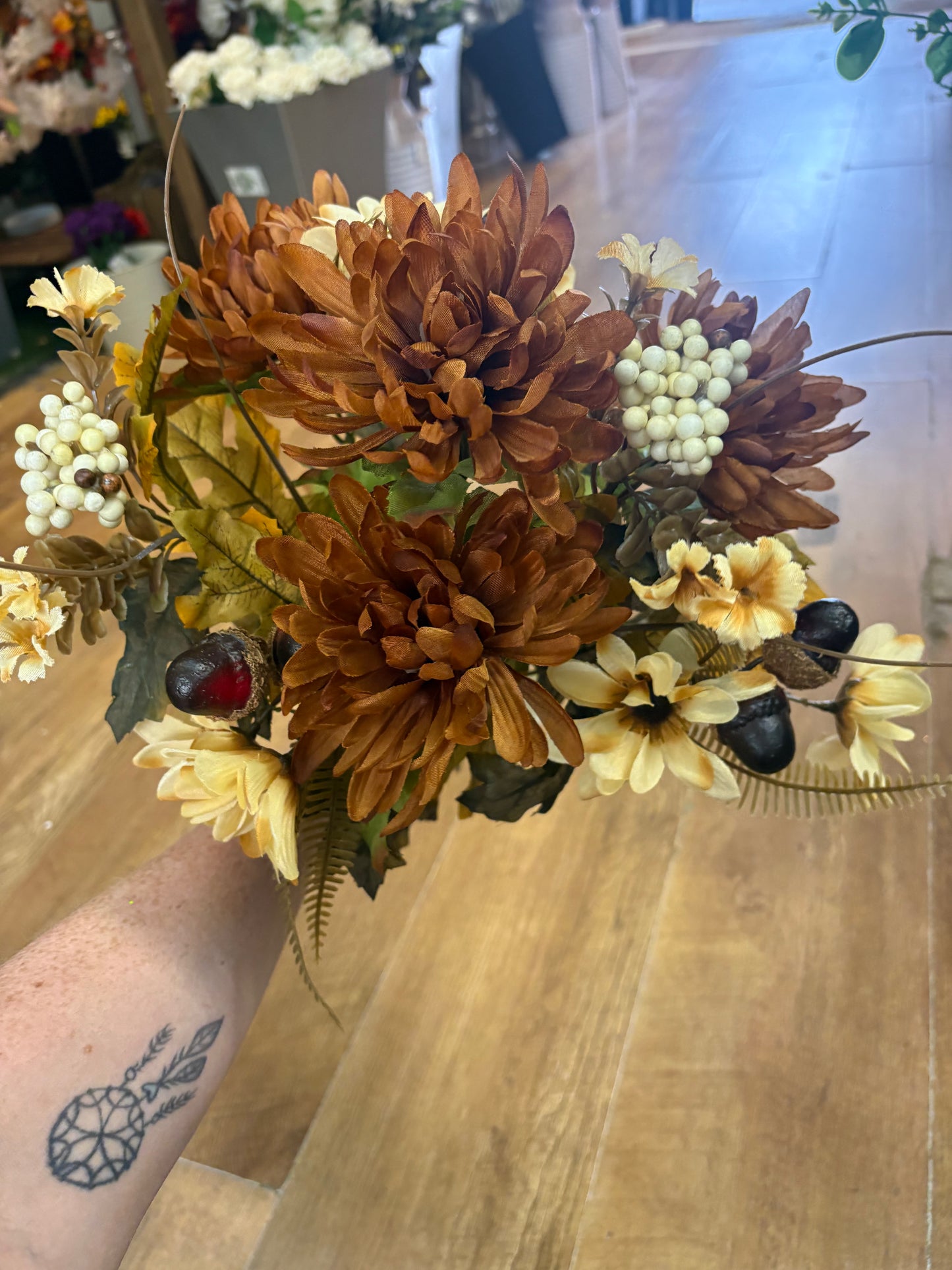 Brown and cream chrysanthemum, daisy and acorn bouquet