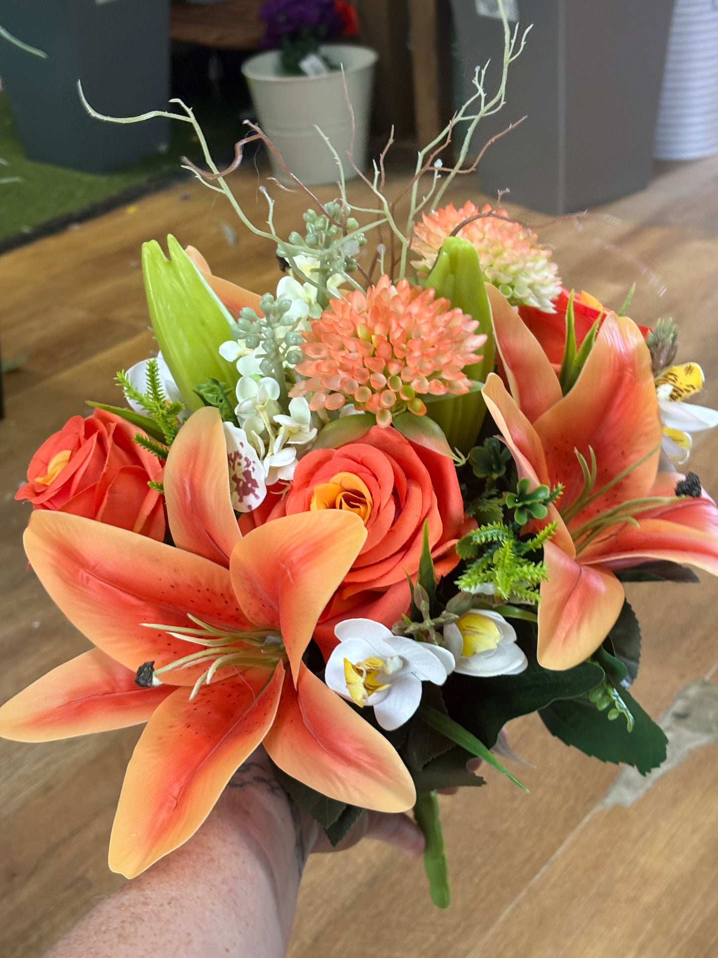 Orange Premium lily, rose and mixed florals/foliage bouquet with 1m of matching satin ribbon