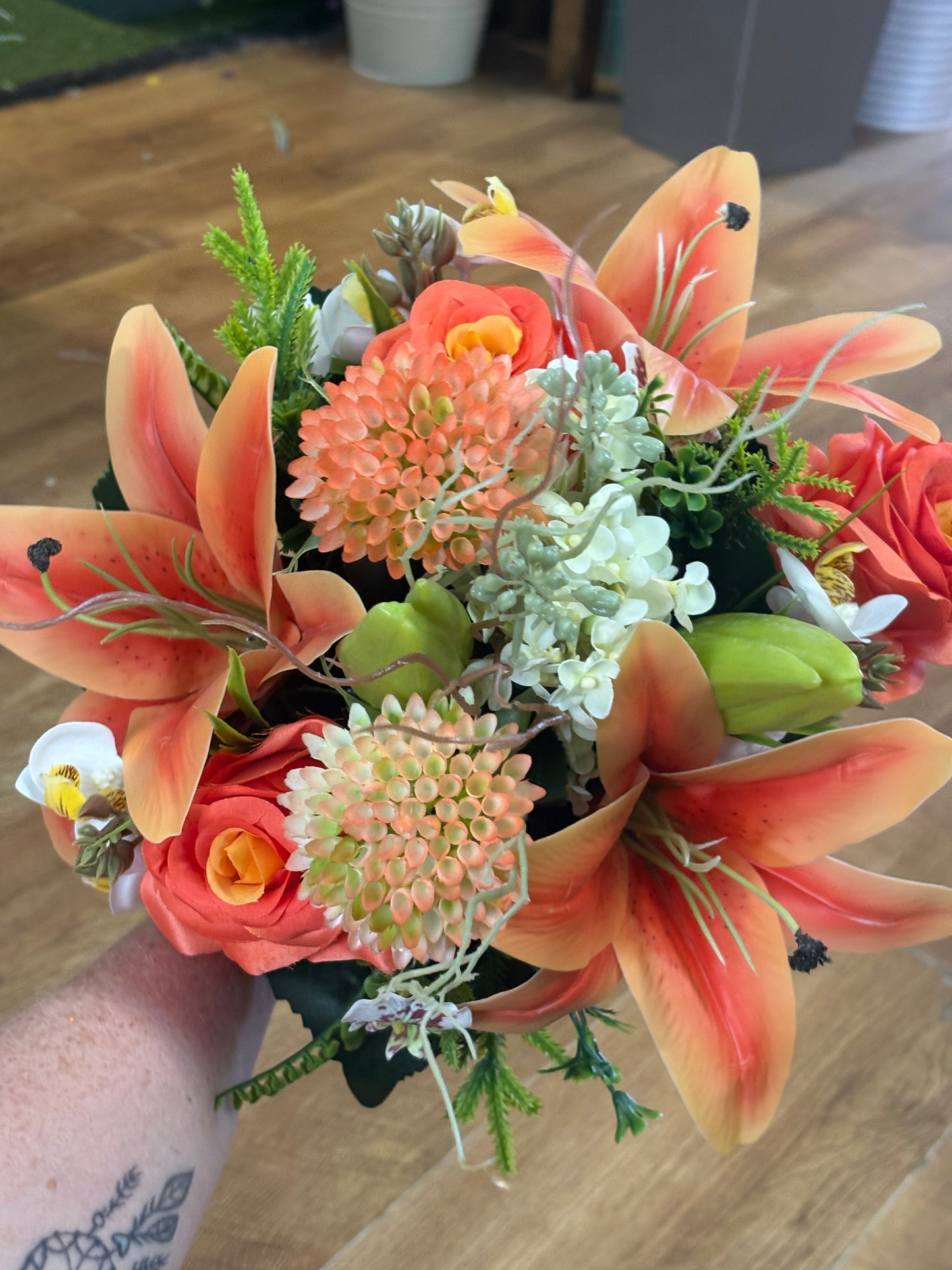Orange Premium lily, rose and mixed florals/foliage bouquet with 1m of matching satin ribbon