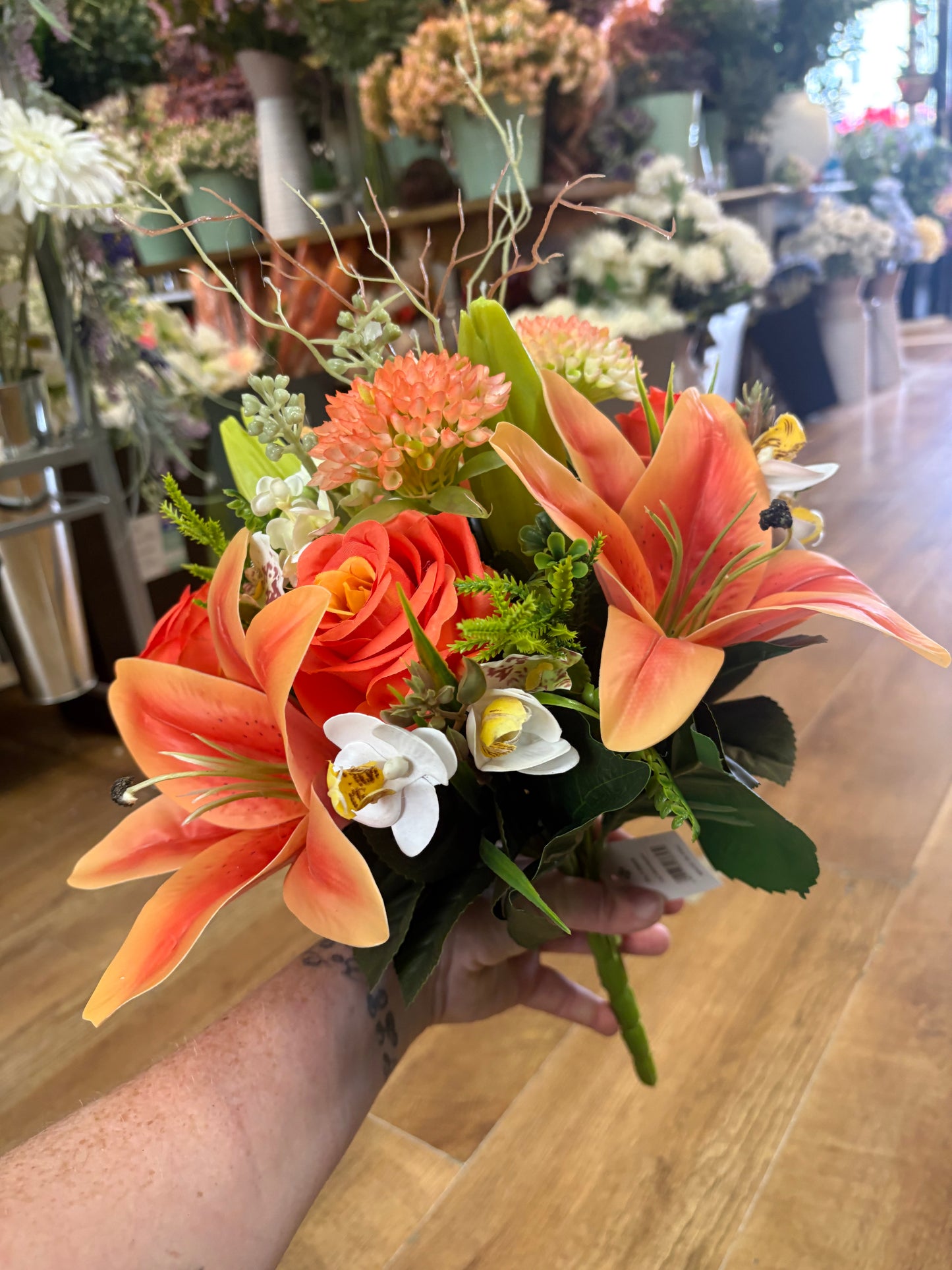 Orange Premium lily, rose and mixed florals/foliage bouquet with 1m of matching satin ribbon