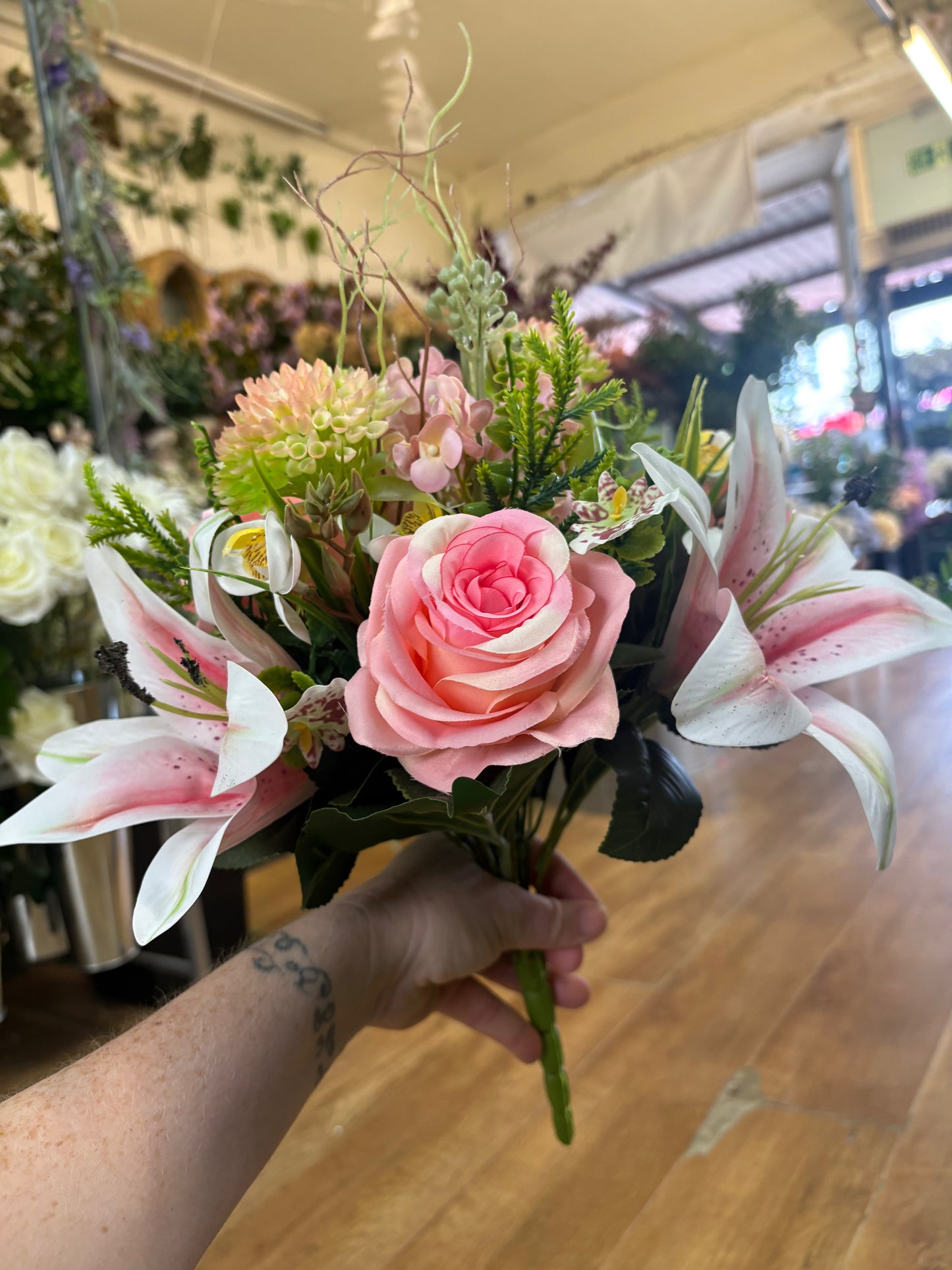 Pink Premium lily, rose and mixed florals/foliage bouquet with 1m of matching satin ribbon