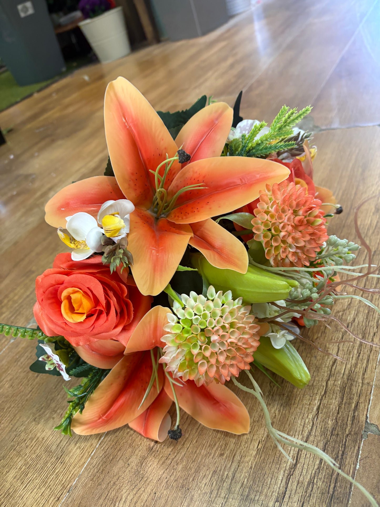 Orange Premium lily, rose and mixed florals/foliage bouquet with 1m of matching satin ribbon