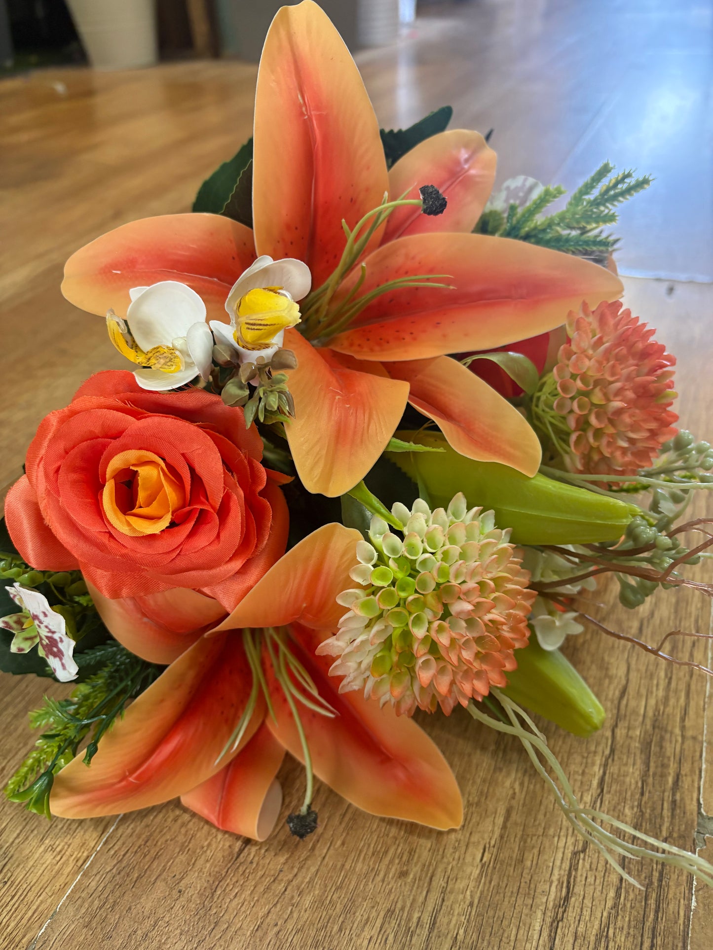 Orange Premium lily, rose and mixed florals/foliage bouquet with 1m of matching satin ribbon