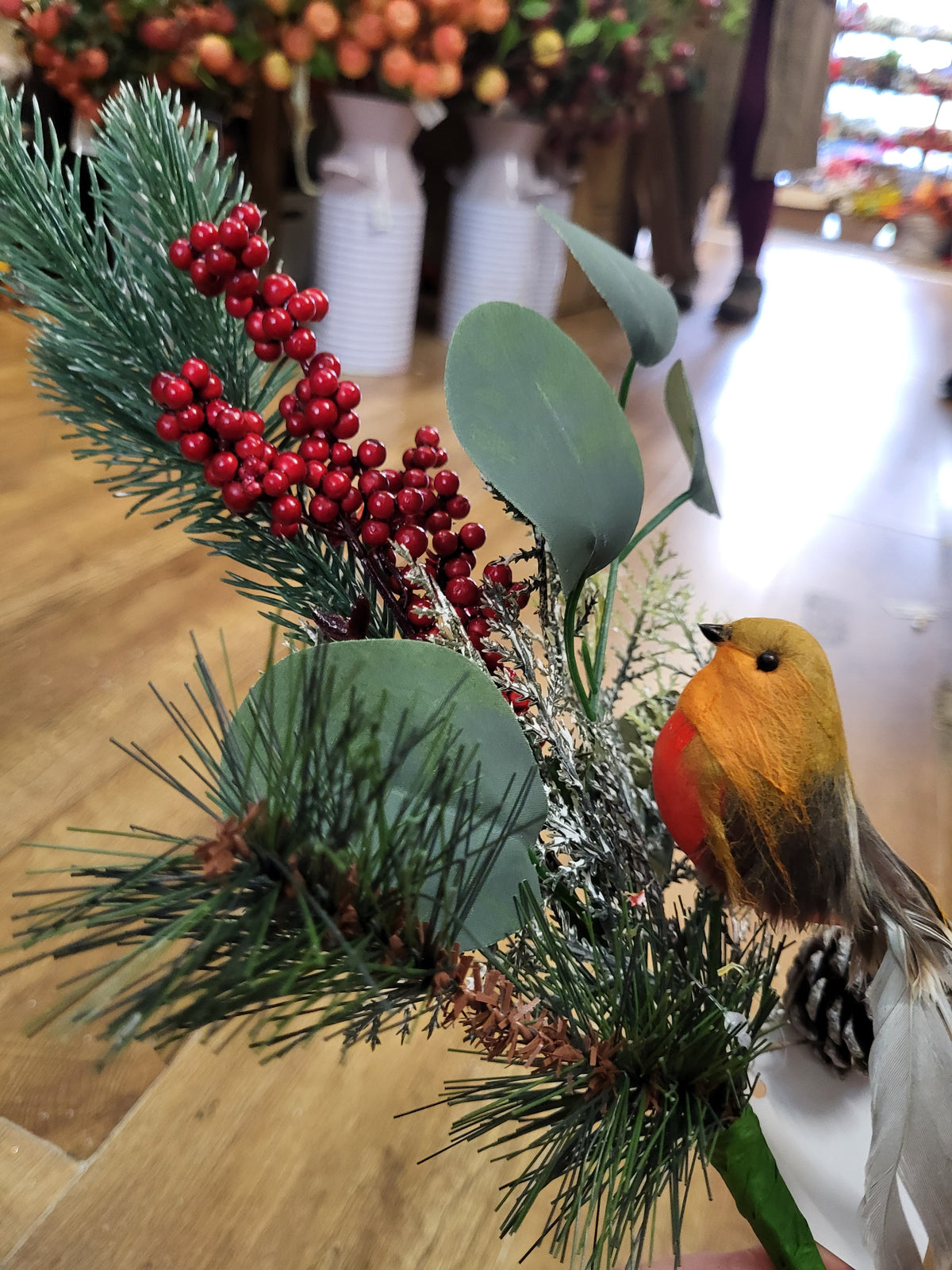 Mixed winter foliage and berry branch with a Robin image 1