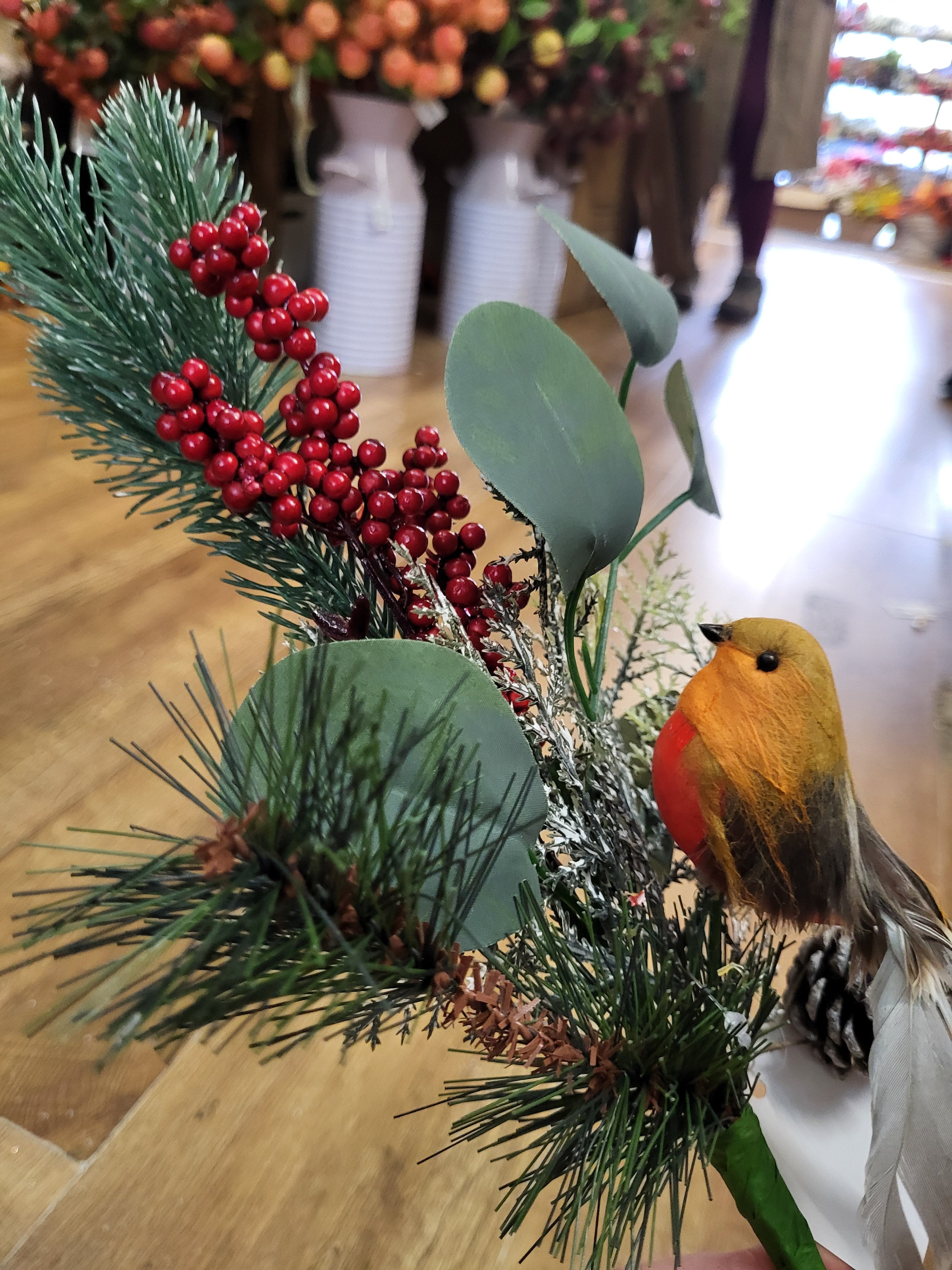 Mixed winter foliage and berry branch with a Robin image 1