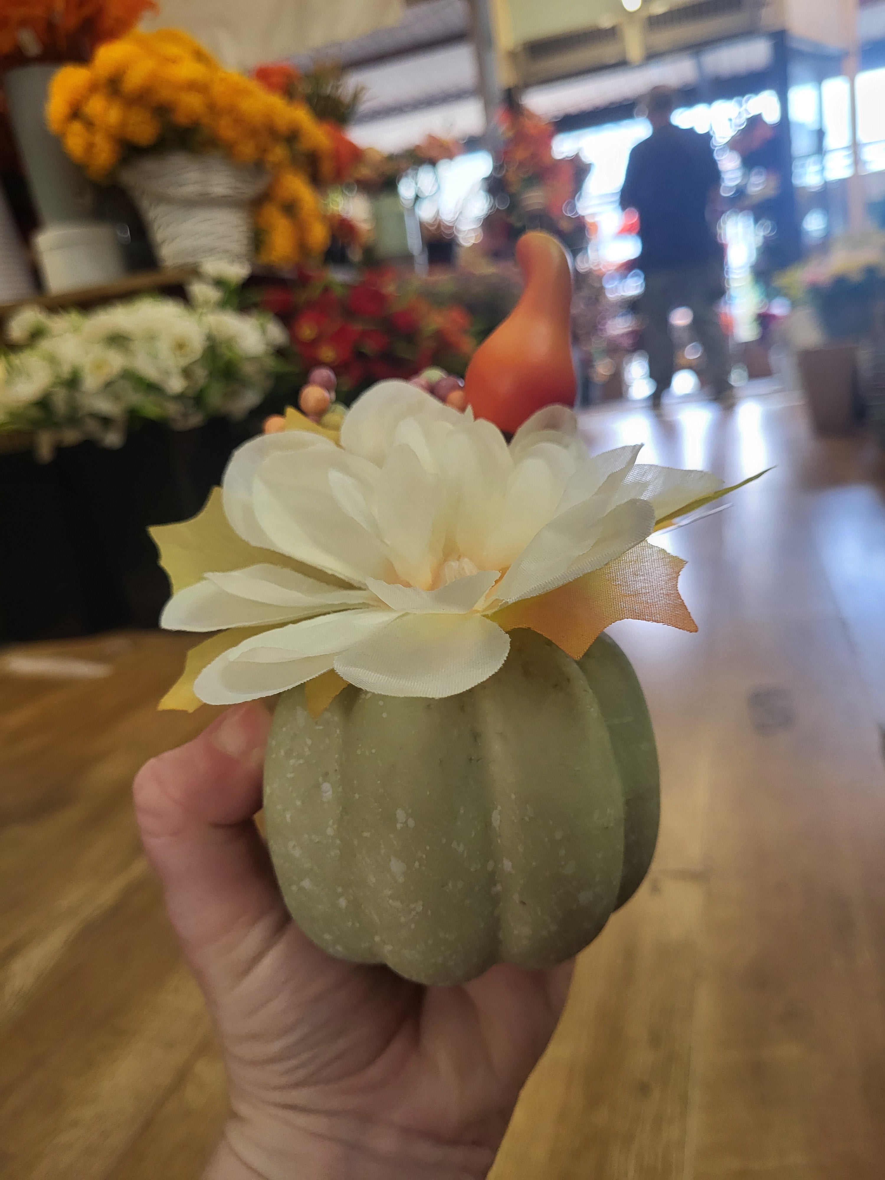 Small decorated pumpkin with cream flower image 0