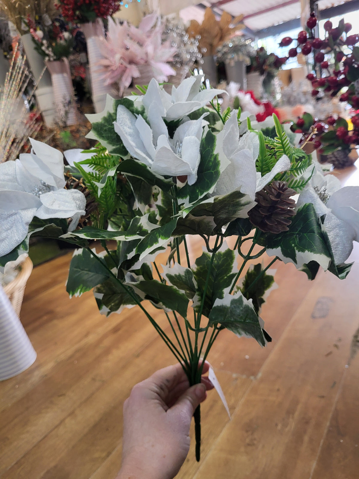 Large white velvet poinsettia and cone bouquet  image 5