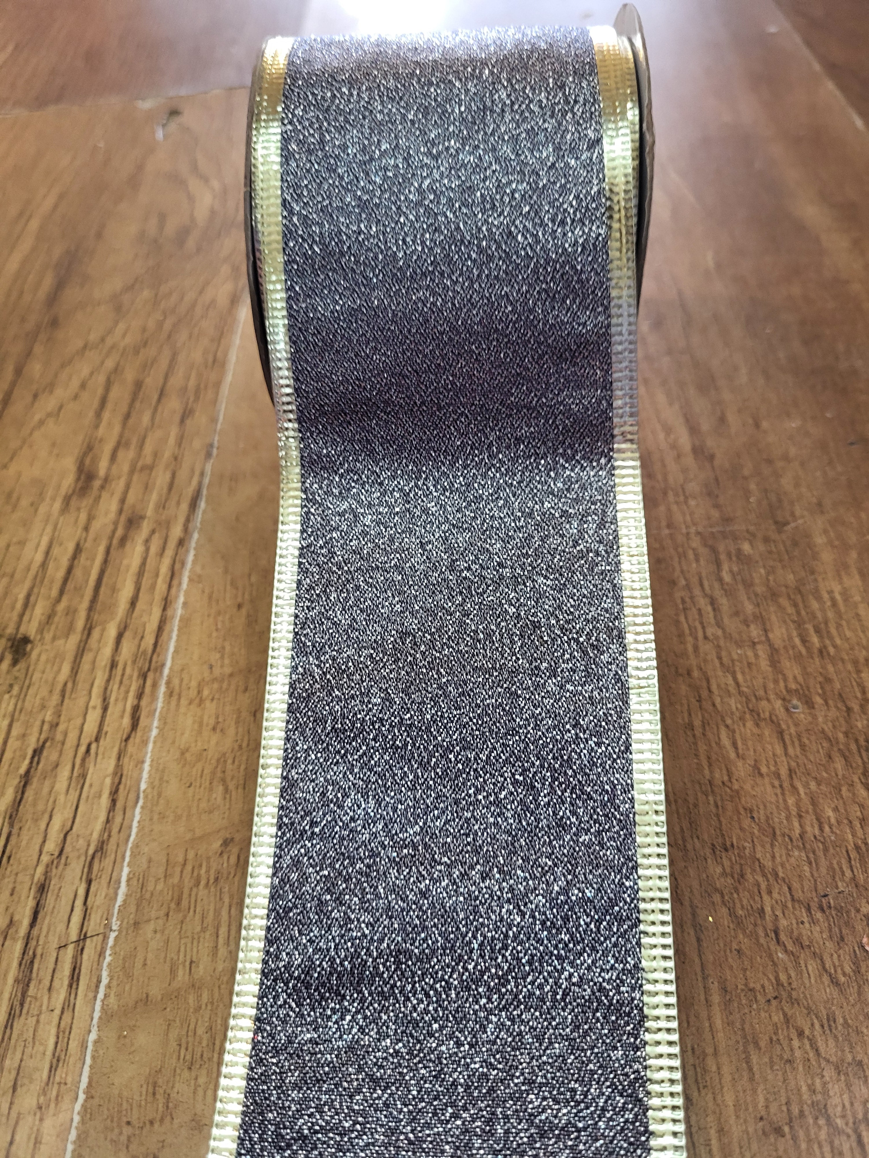 2.7m approx. roll of navy/champagne gold shimmery wired ribbon image 0