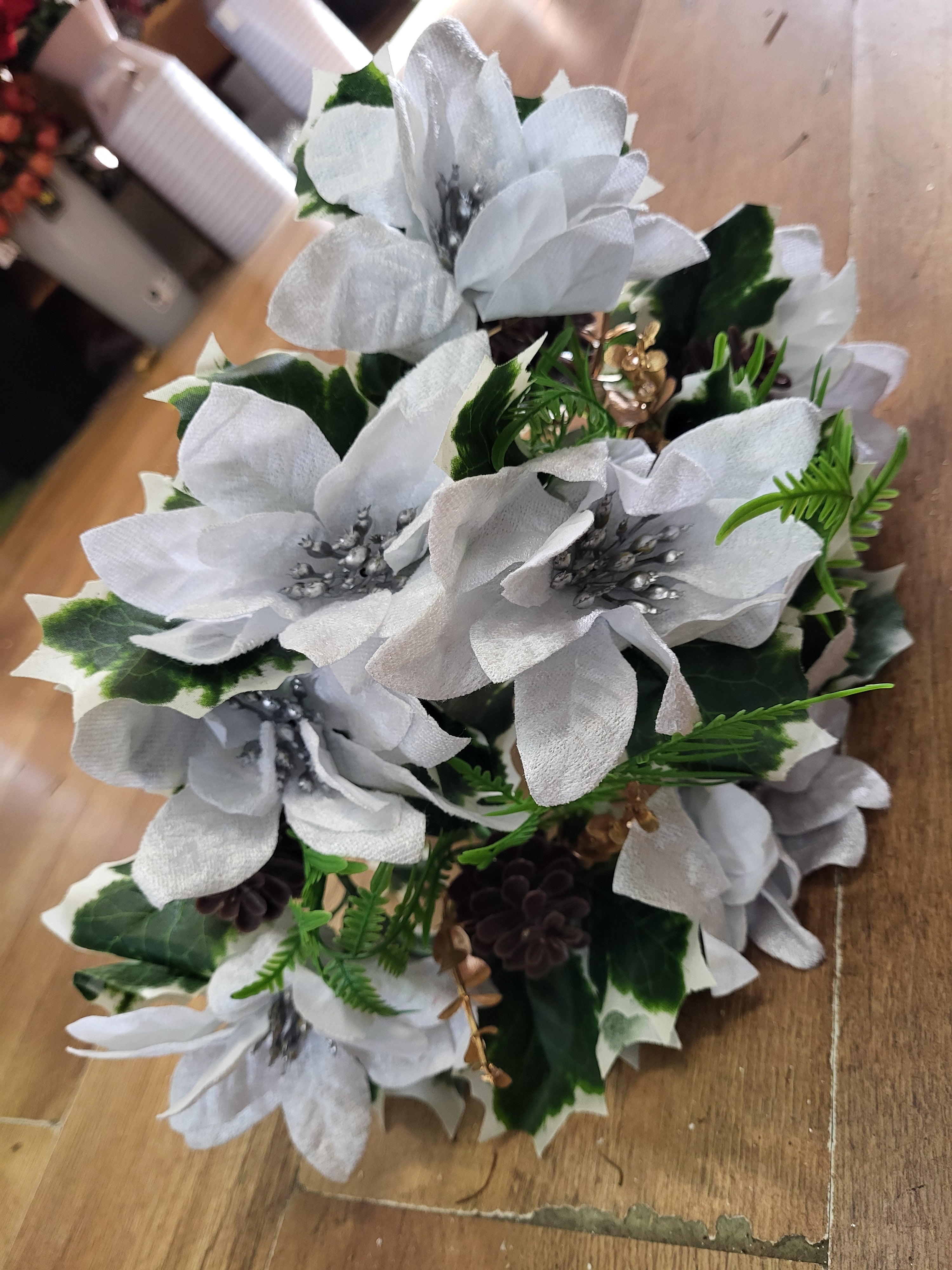 Large white velvet poinsettia and cone bouquet  image 2