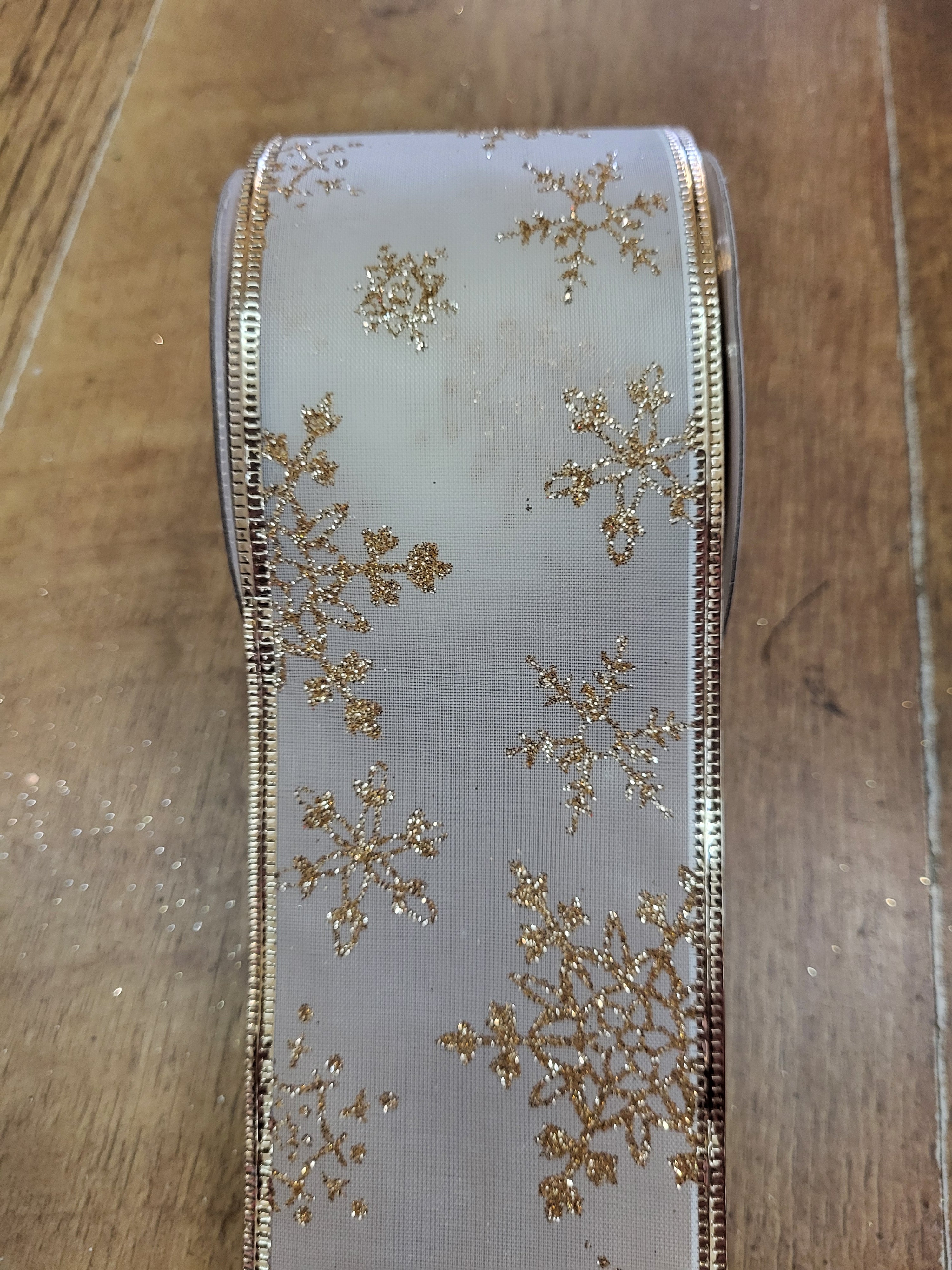 2.7m approx. roll of gold/cream snowflake wired ribbon image 0