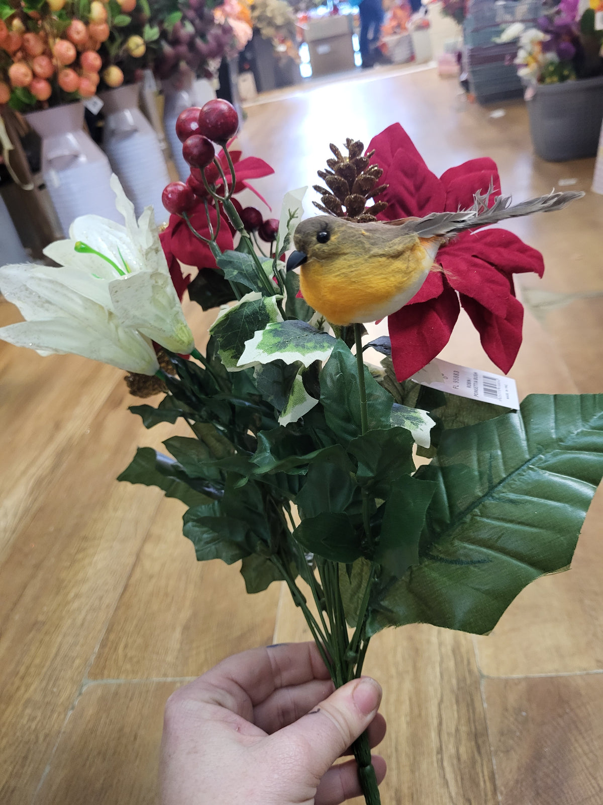 Poinsettia, lily and robin bouquet  image 2