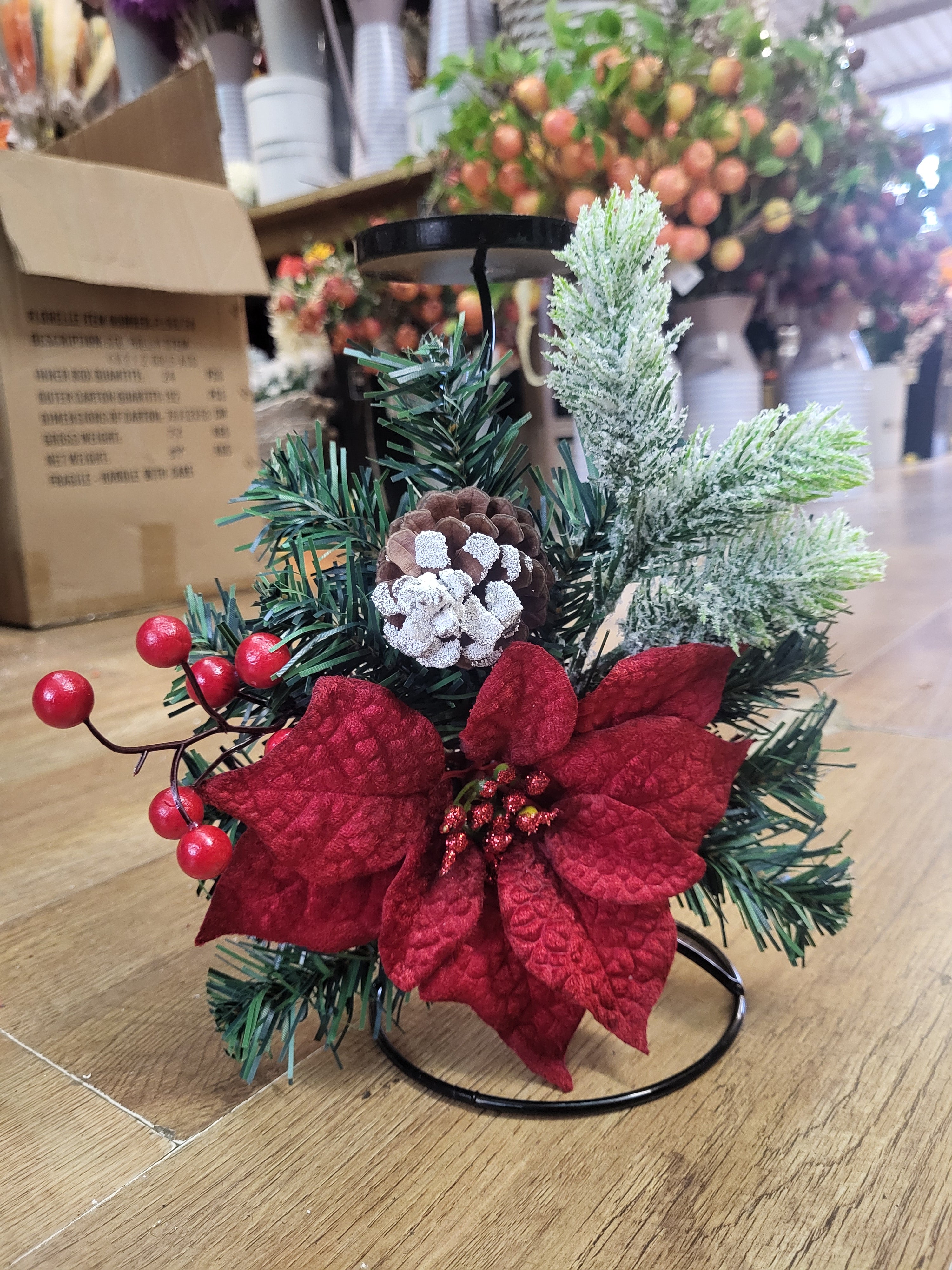 Red poinsettia and snowy foliage decorated metal candle holder image 1