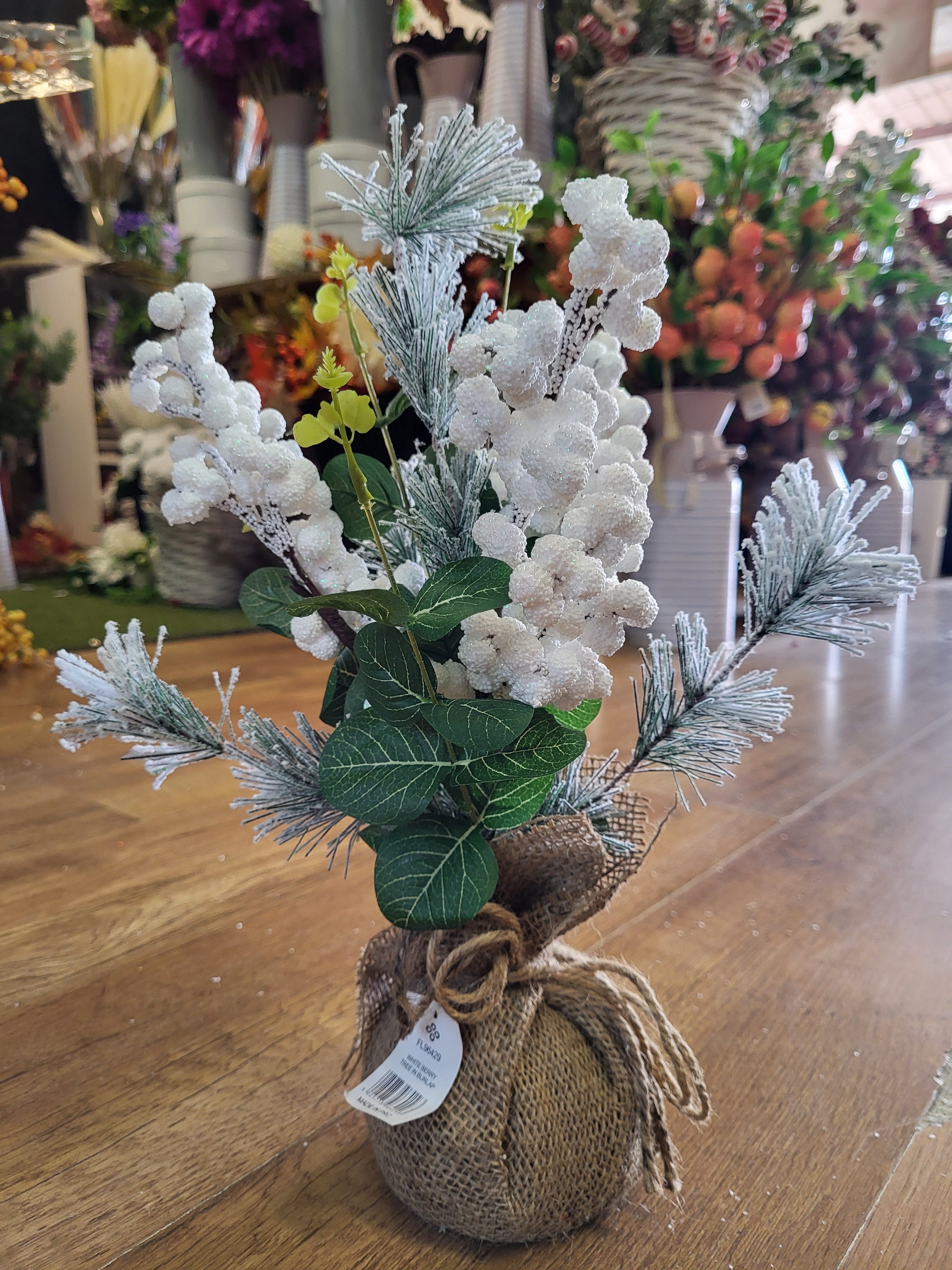Frosted white berries and foliage wrapped in burlap - table centre piece image 0