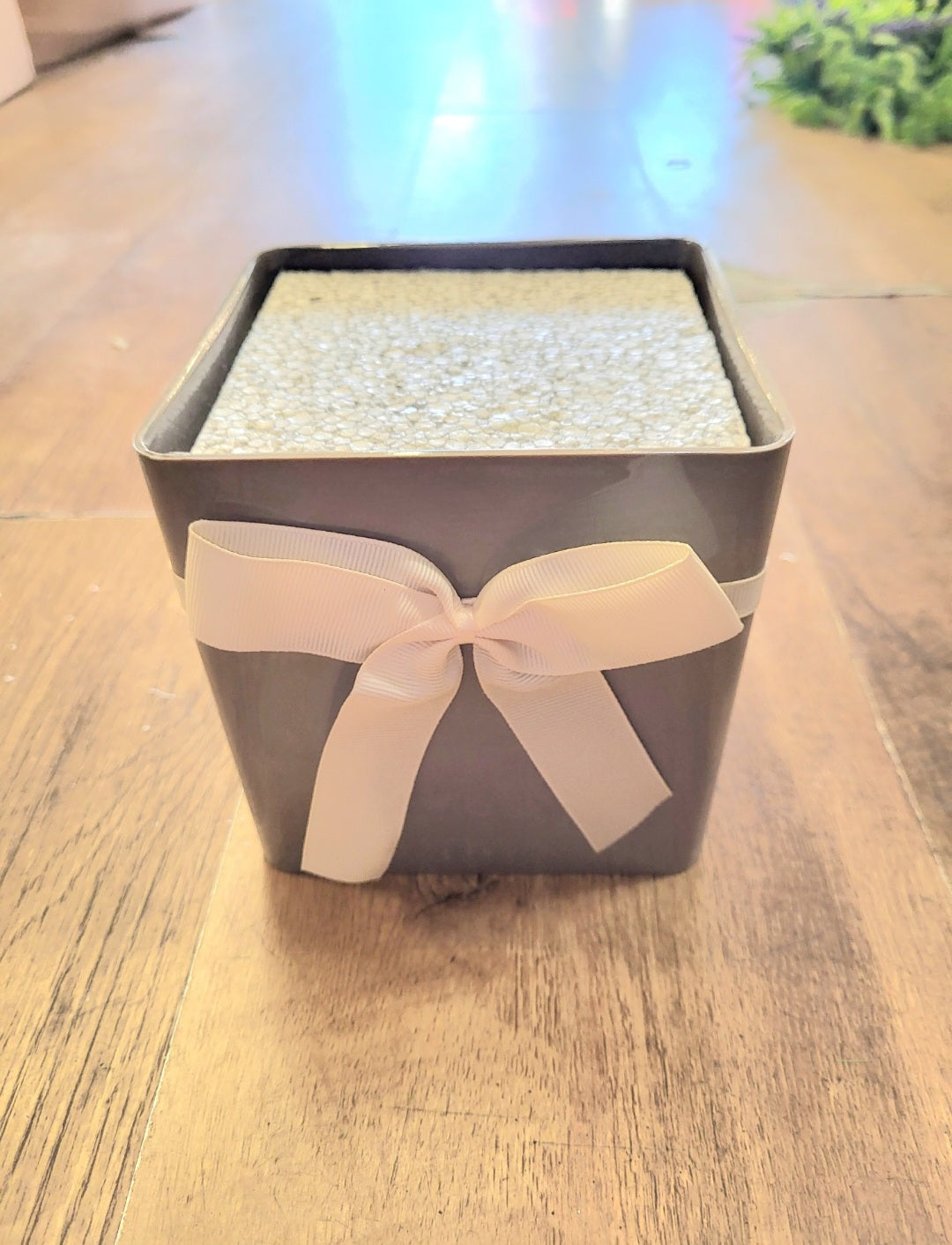 Grey floral box with white bow and filled with polystyrene  image 1