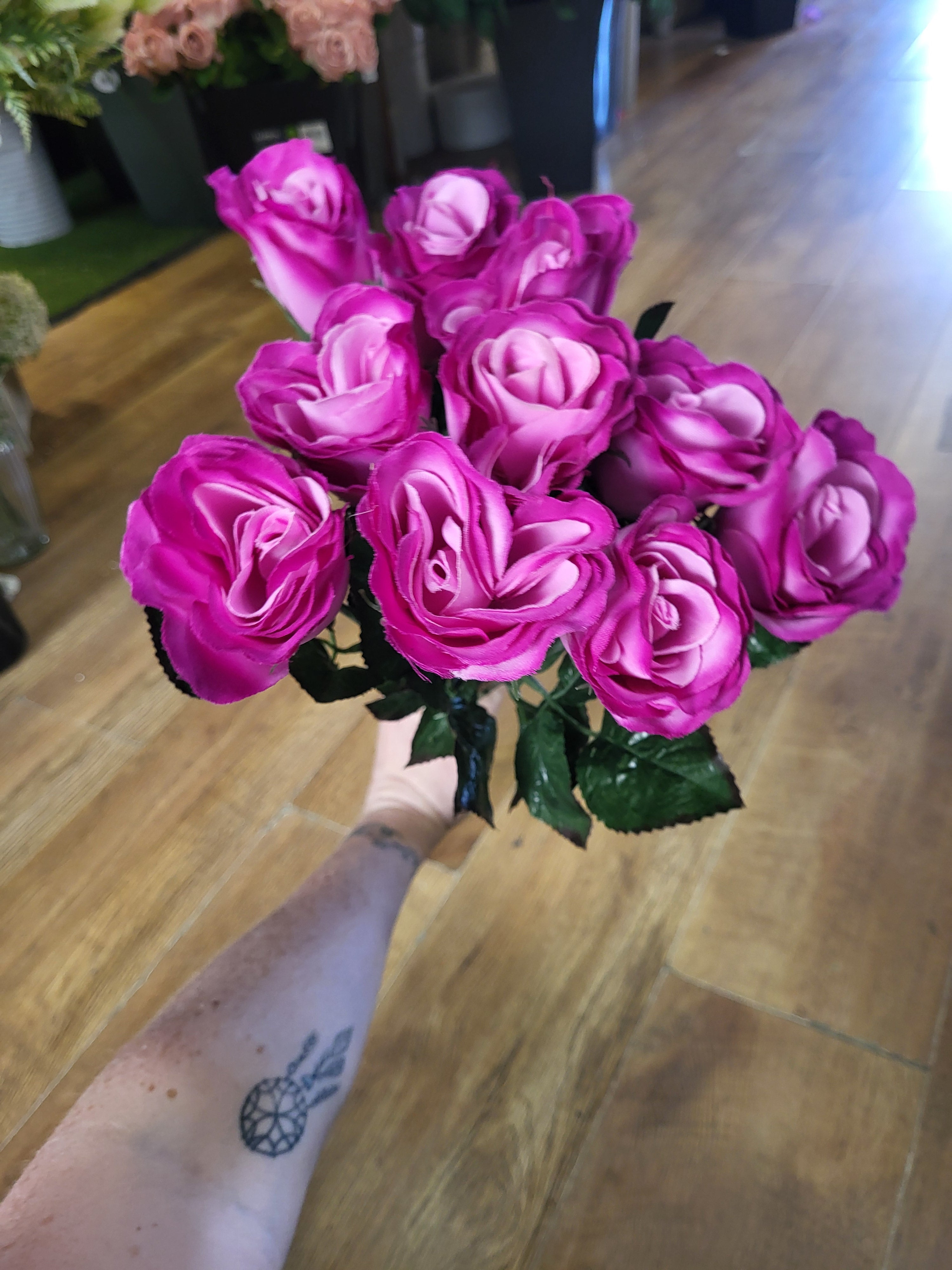 Bundle of 10 long stem raspberry closed roses image 1