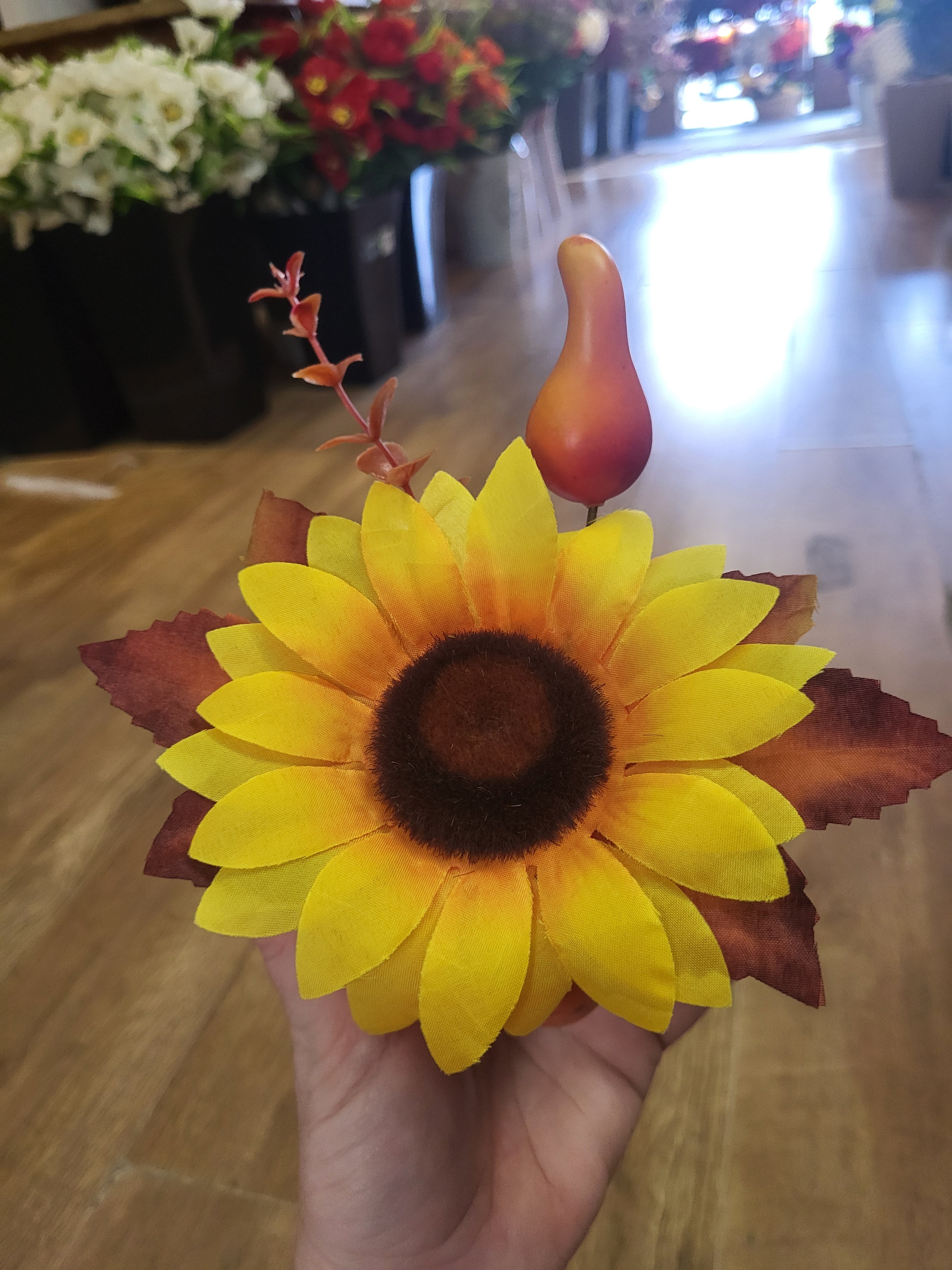 Small decorated pumpkin with yellow flower image 1